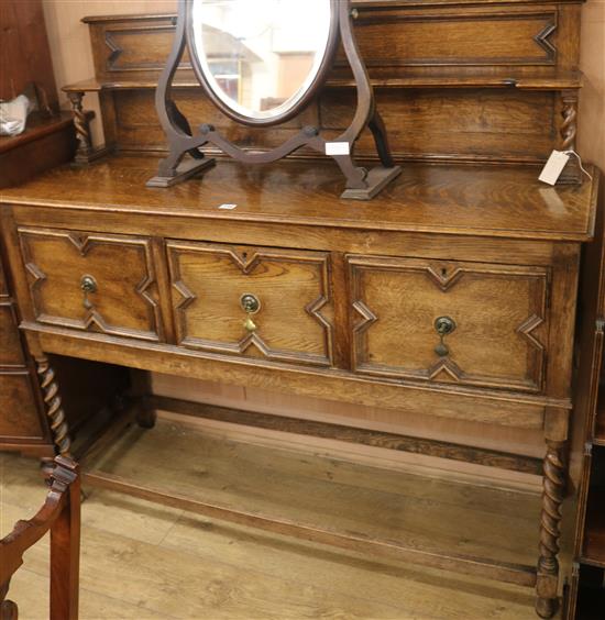 A 1920s oak sideboard, W.138cm